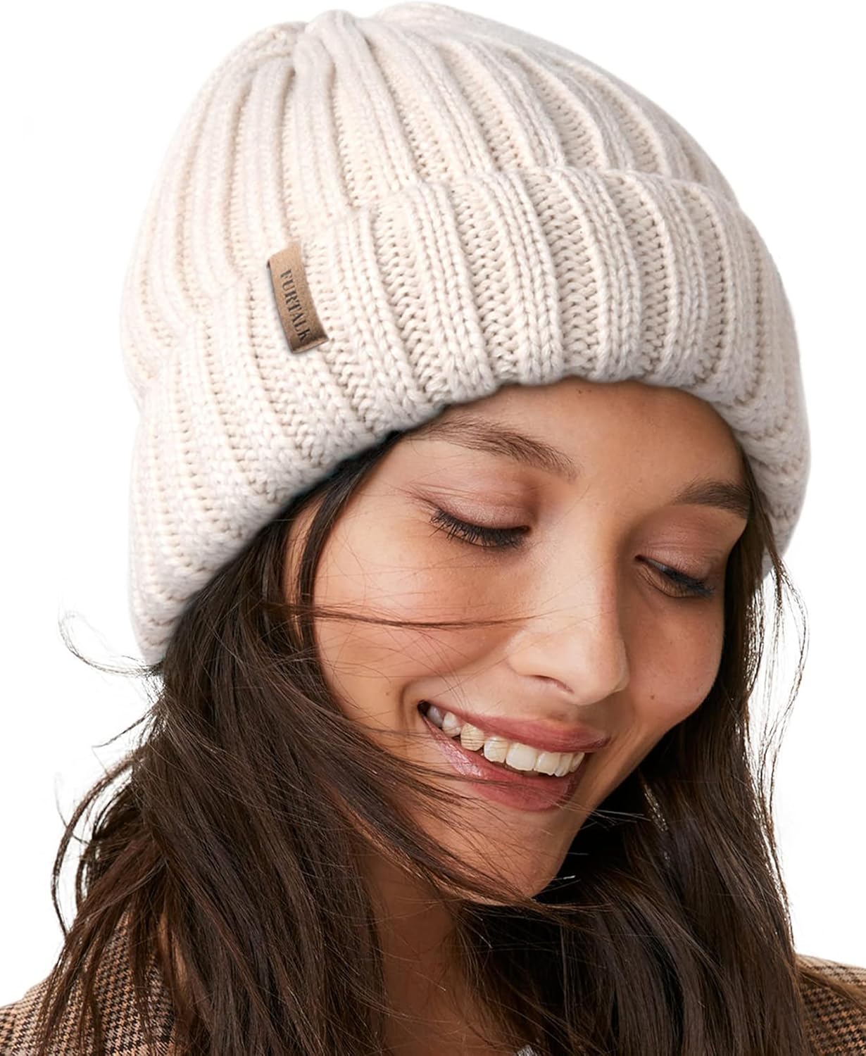 Cream chunky knit beanie with fleece lining and small leather brand patch
