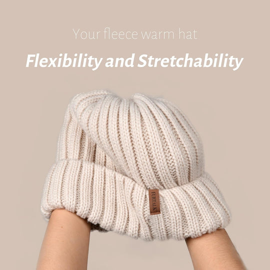 Cream ribbed knit beanie with folded cuff and fleece lining