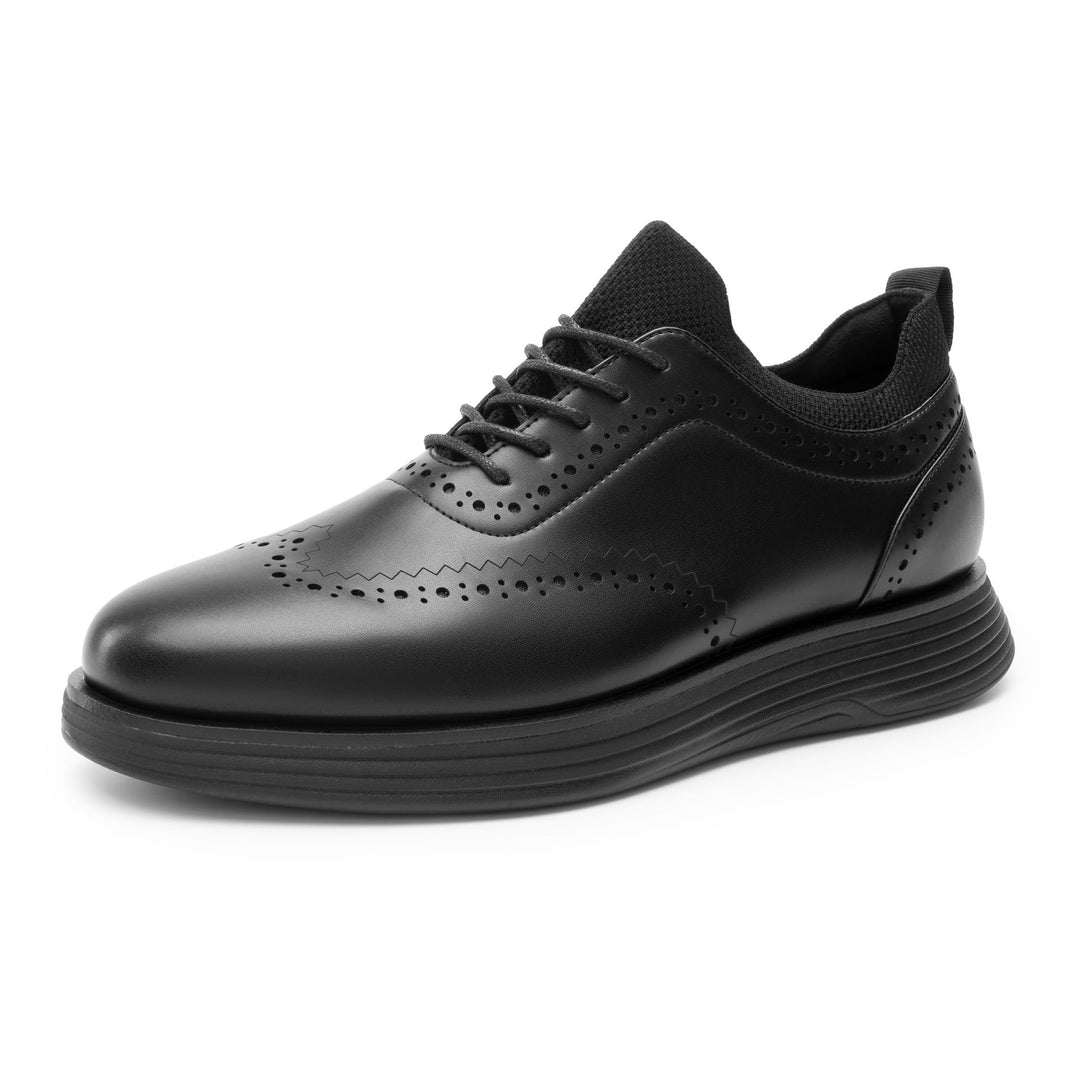 Black lace-up sneakers with wingtip perforations and chunky rubber outsole