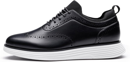 Black wingtip sneakers side view with brogue holes and ribbed white midsole