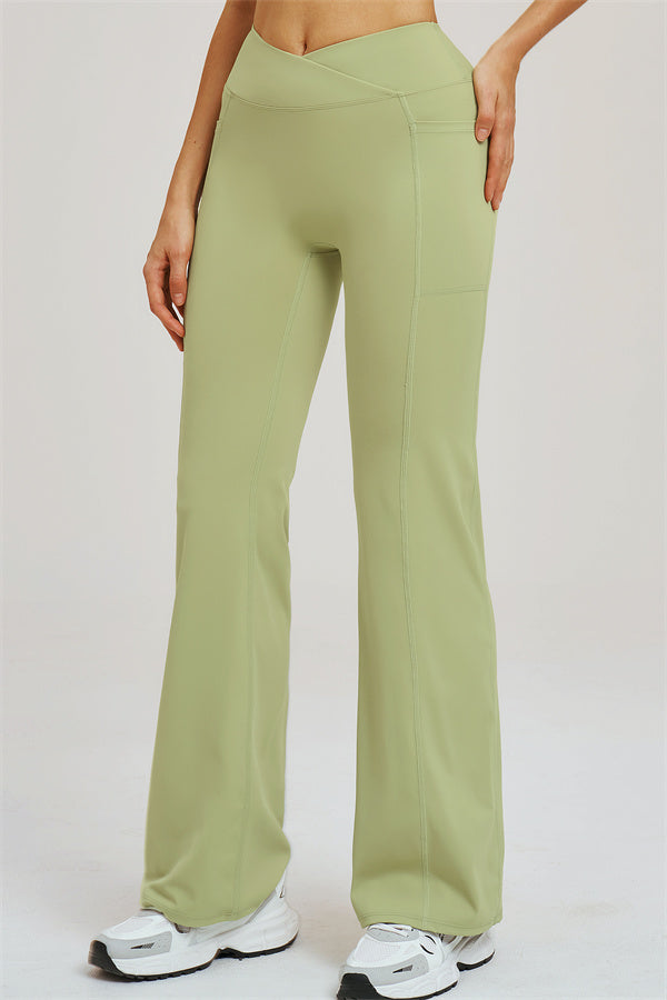 Olive green flared leggings with front seam and wide bell shape