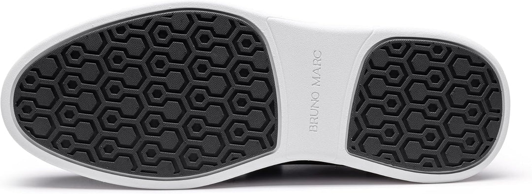 Close-up of black sneaker outsole with hexagonal grip tread and white edge