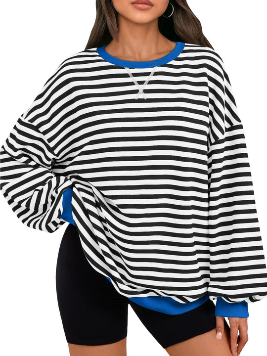 Black-and-white striped oversized sweatshirt with crew neck lace detail, blue cuffs