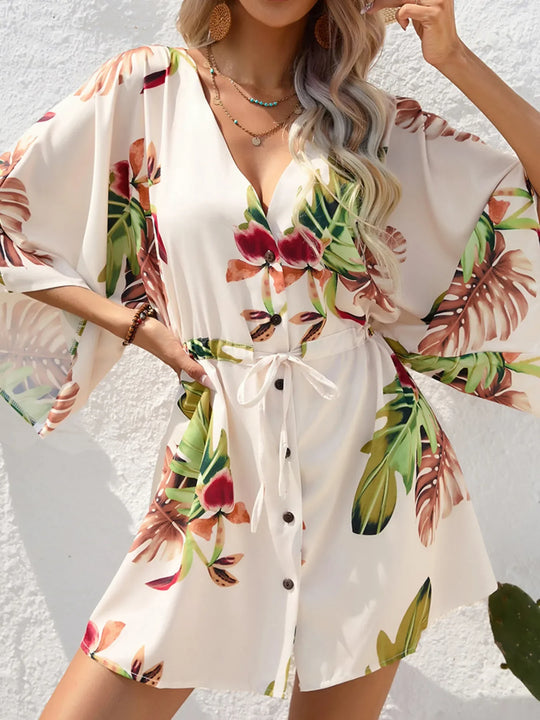 Floral button-up mini dress with tie waist, V-neck, and half sleeves