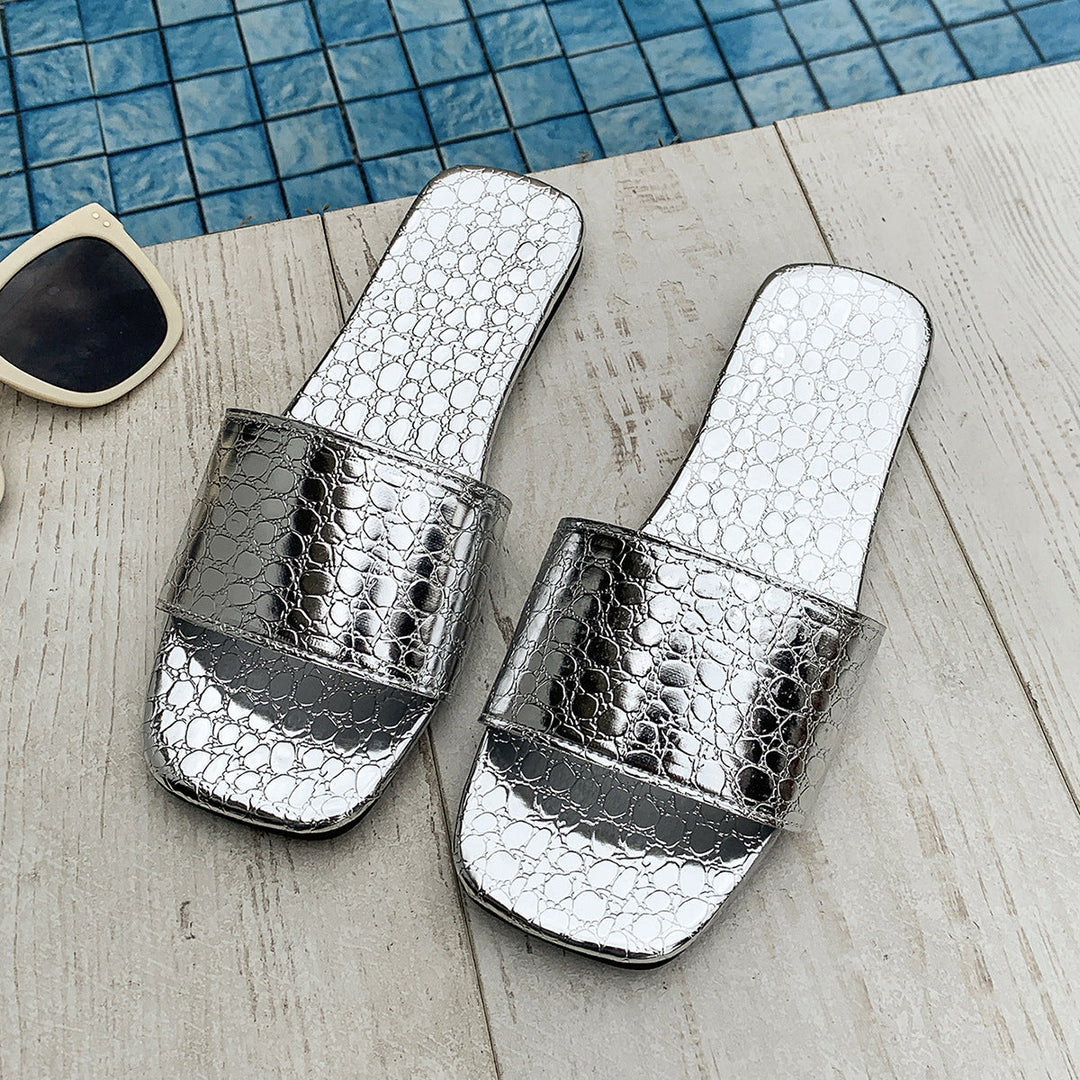 Silver crocodile-textured square-toe slide sandals, flat wide strap pair