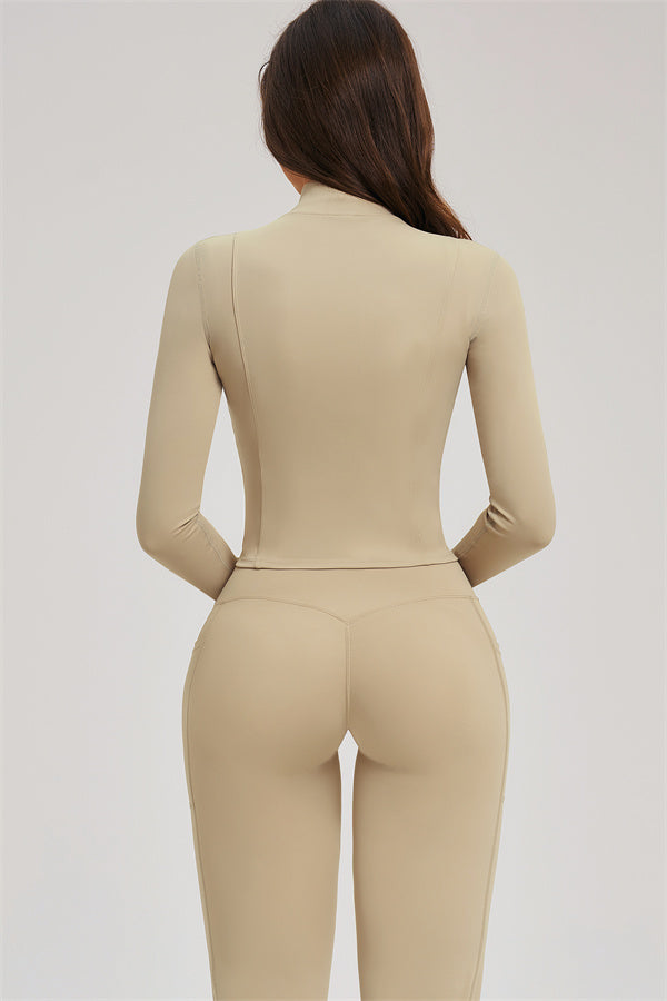 Almond activewear set: back view of zip jacket and flared leggings
