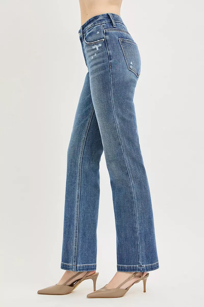 Medium wash straight jeans, side view with belt loops and classic seam detailing