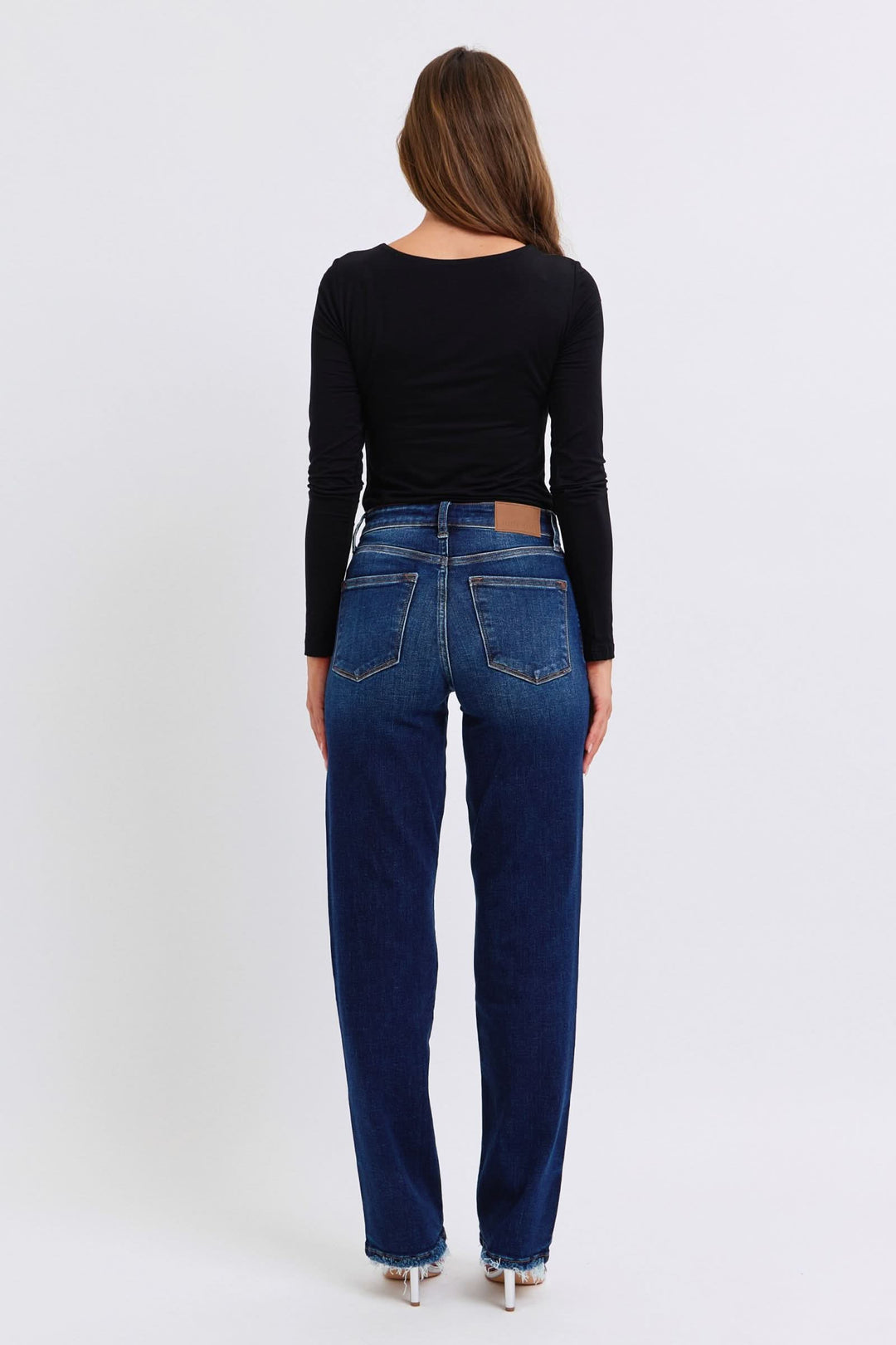Jeans back view in dark wash, full size straight leg with raw hem and belt loops