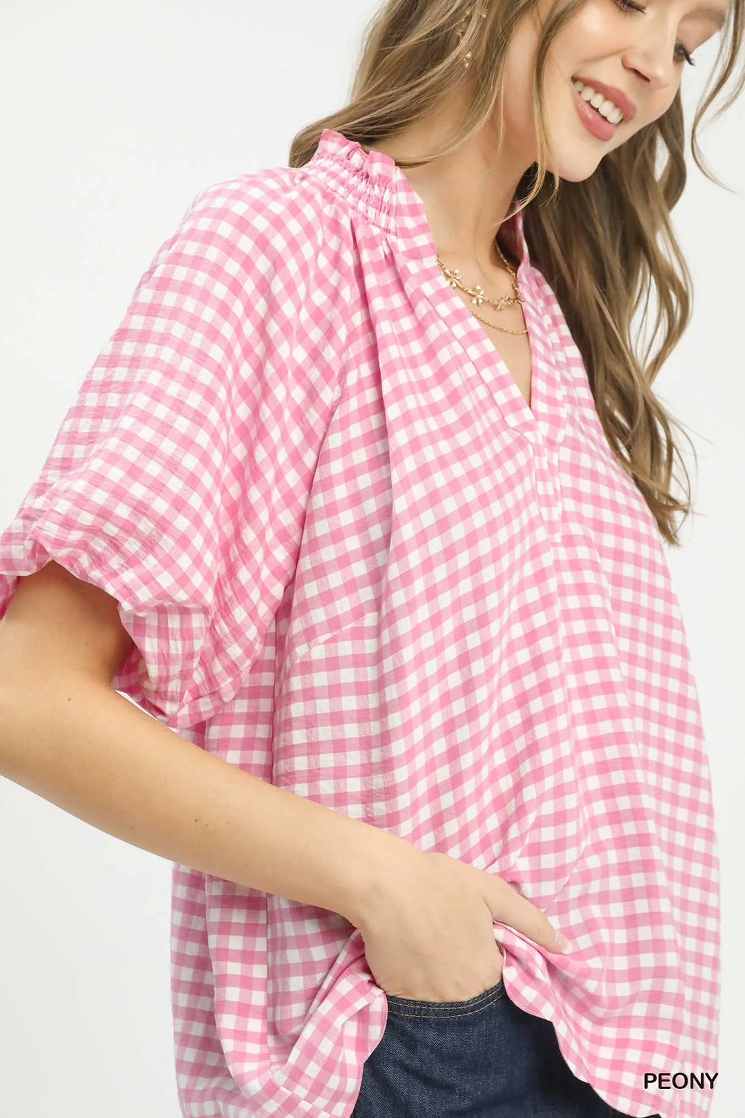 Pink PEONY gingham blouse close-up of puff sleeves and V-neck