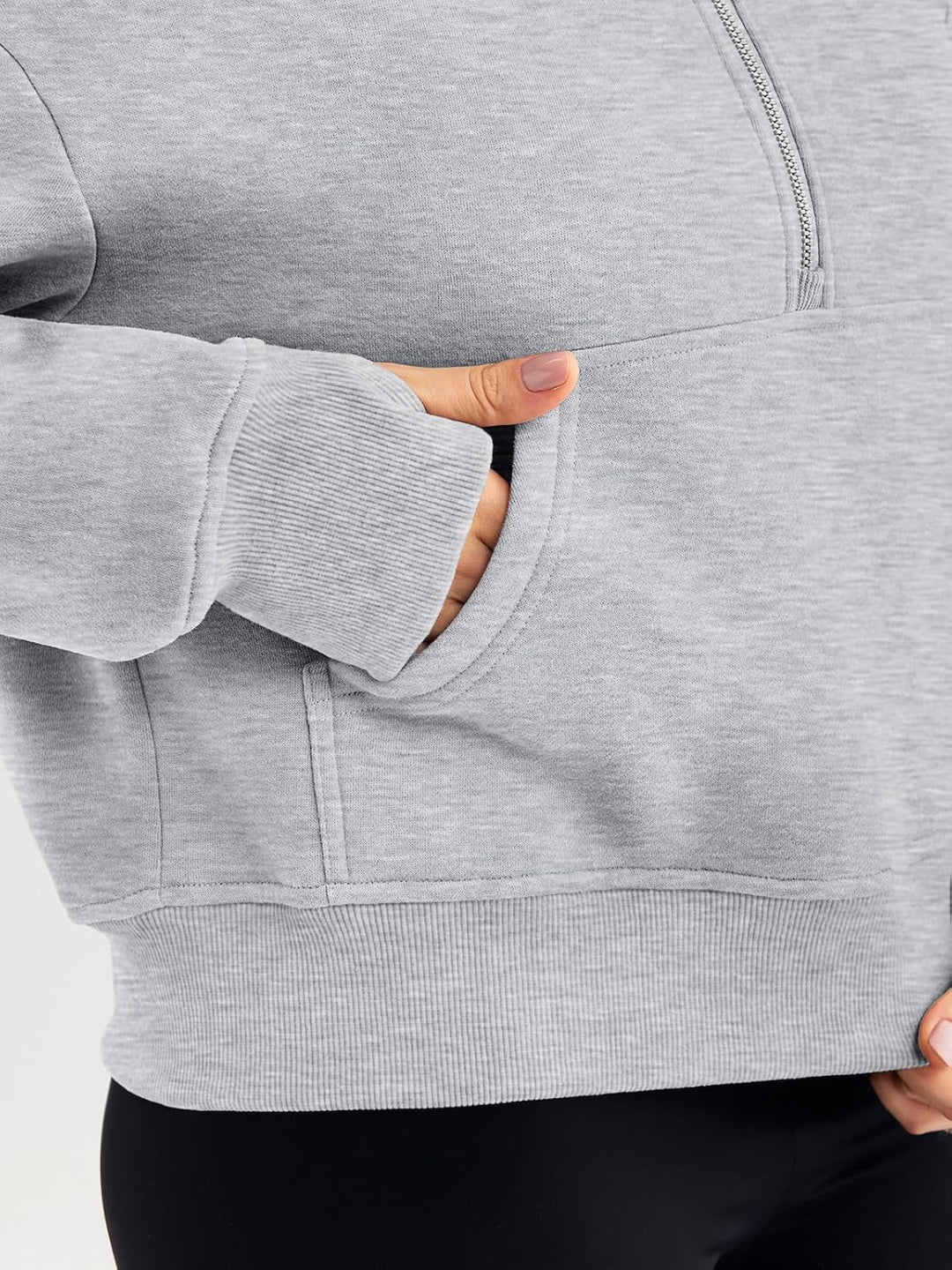 Grey hoodie cuff and front kangaroo pocket opening, relaxed oversized fit