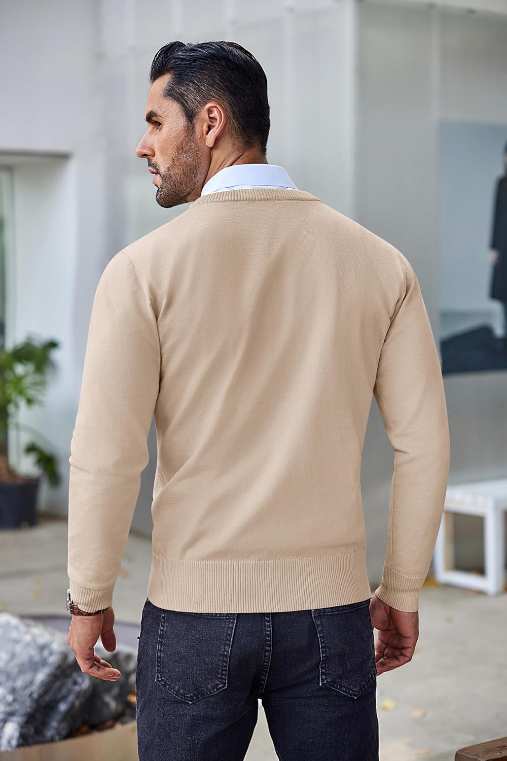 Back view of light tan slim-fit crew neck knit sweater