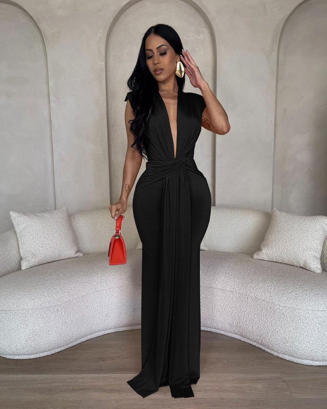 Black deep V evening gown with twist front and long straight leg opening