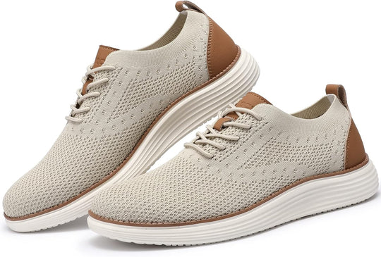 Pair of beige mesh sneakers with brown accents and white ribbed soles