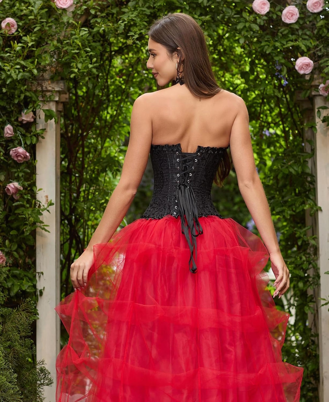 Black corset top back view with lace-up closure and ribbon tie, red tulle skirt