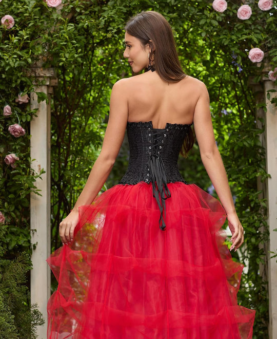 Black corset top back view with lace-up closure and ribbon tie, red tulle skirt