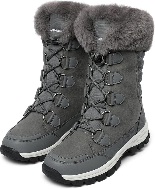 Pair of dark grey lace-up snow boots with faux fur collar and chunky white sole