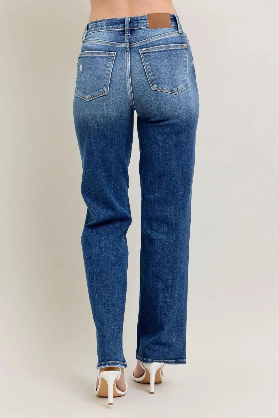 High-waist straight-leg denim jeans, back view, medium blue wash with center back seam