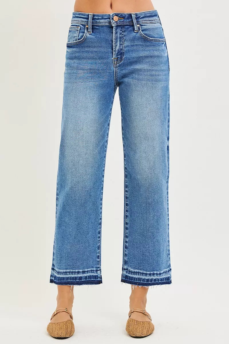 Medium wash cropped boyfriend jeans, back view with two pockets, frayed hem