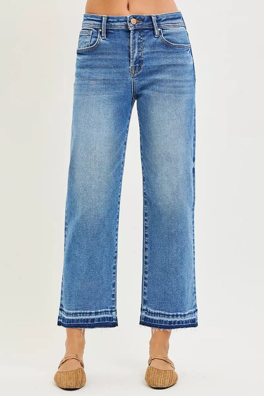 Medium wash cropped boyfriend jeans, back view with two pockets, frayed hem