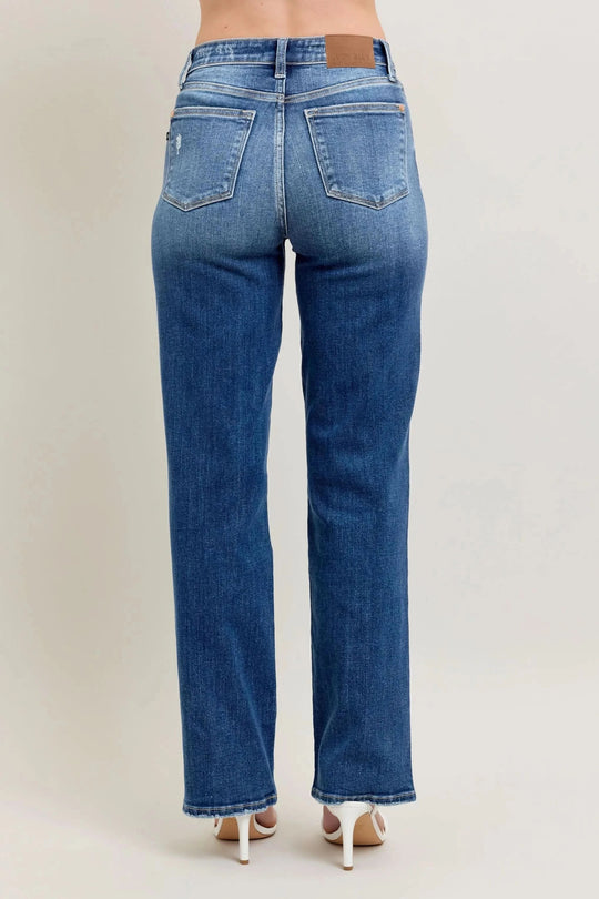 Back view of high-waist straight-leg jeans with two rear patch pockets, medium blue wash