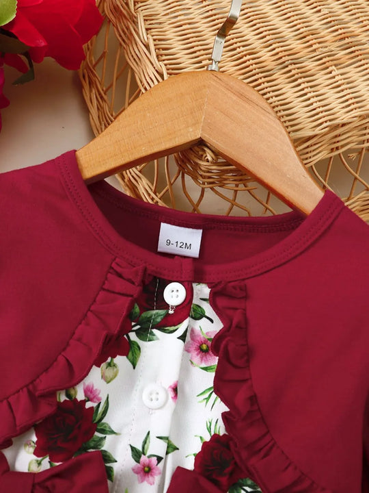 Round-neck close-up: deep red top with floral panel, ruffled placket and buttons