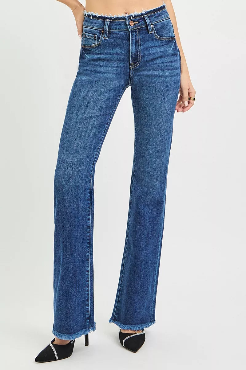 Dark blue mid-rise bootcut jeans with raw frayed hem