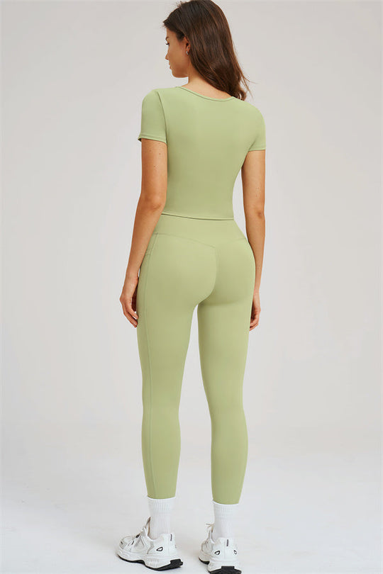 Olive green T-shirt and leggings set, back view with short sleeves and fitted leggings