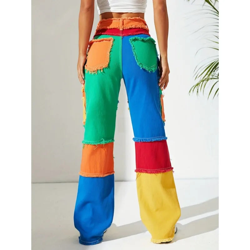 Front view patchwork denim jeans with colorful panels and frayed raw hems