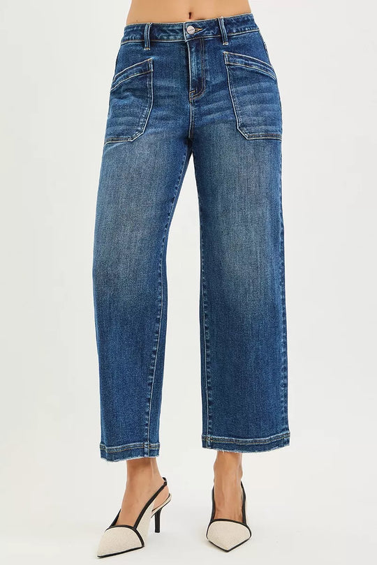 Dark blue slouchy jeans with front patch pockets and cuffed hems