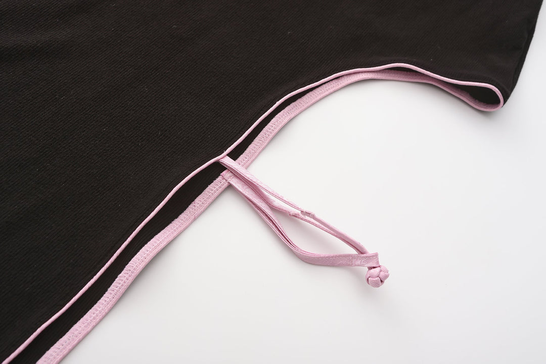 Gao cutout maxi dress tie-strap detail, pink cord crossing and fastening on black fabric