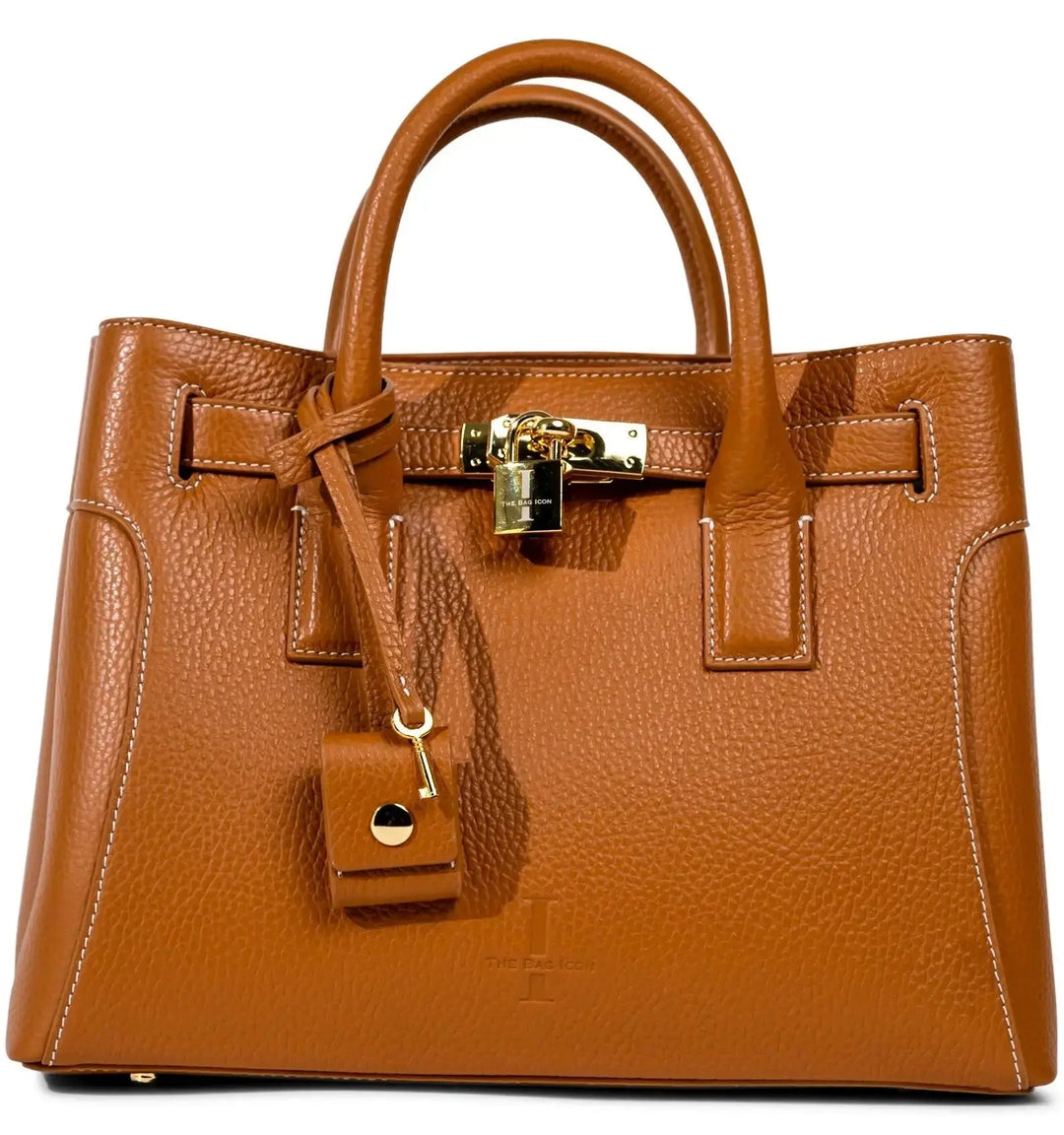 Camel-brown grained leather satchel with gold lock and side strap pulls