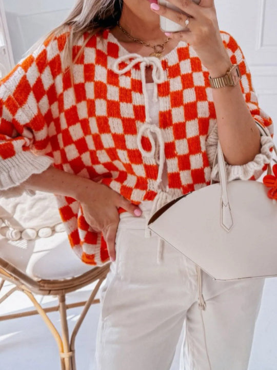 Orange and white checked knit cardigan with front tie cords and loose fit, short sleeves
