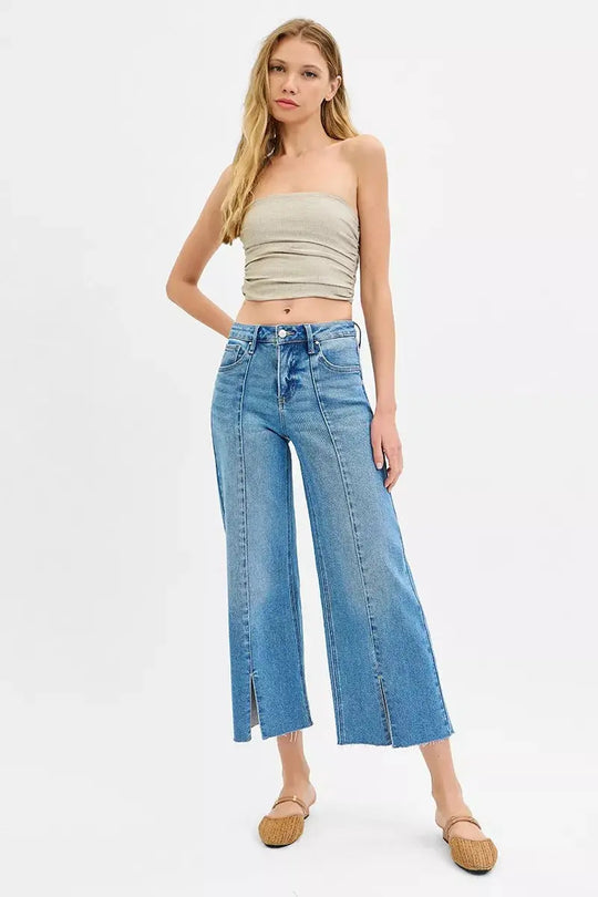 Medium-wash wide-leg crop jeans with zip fly, belt loops, and front slits
