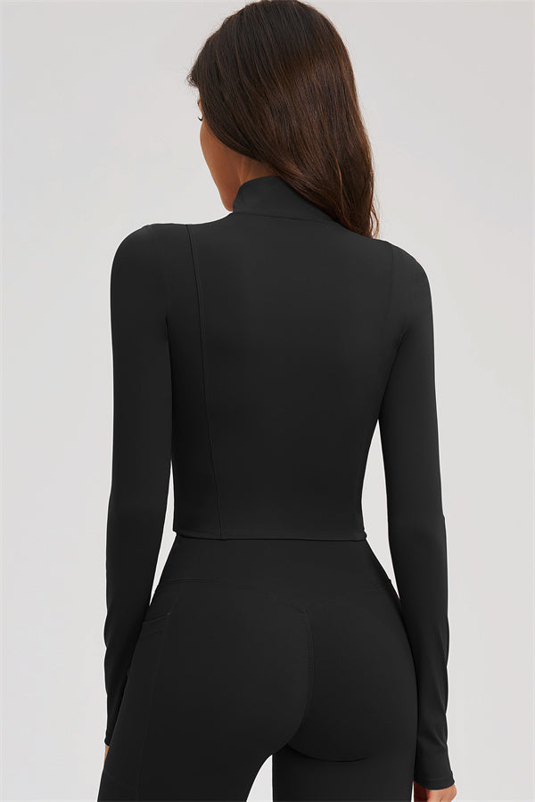Black back view of zip-front cropped sports jacket with matching flared leggings