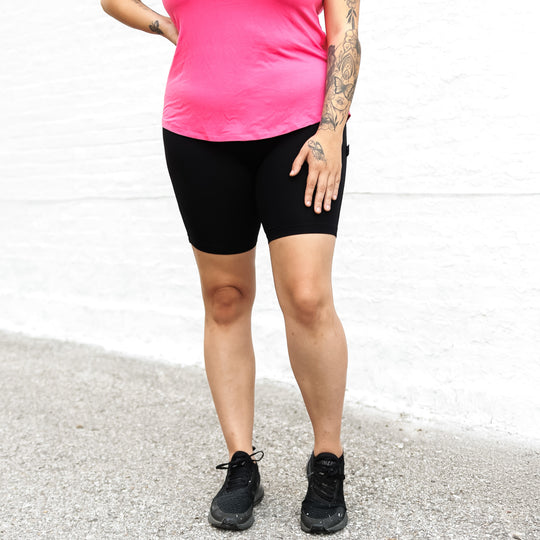 Solid black biker shorts, mid-thigh length