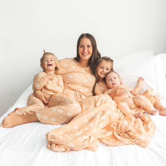 Peach ribbed pajama set with rainbow print: button henley top and tied pants