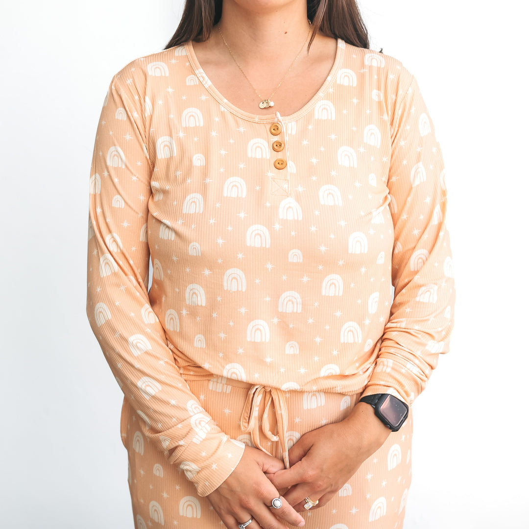 Peach ribbed pajama top with rainbow print, wood-button henley and long sleeves