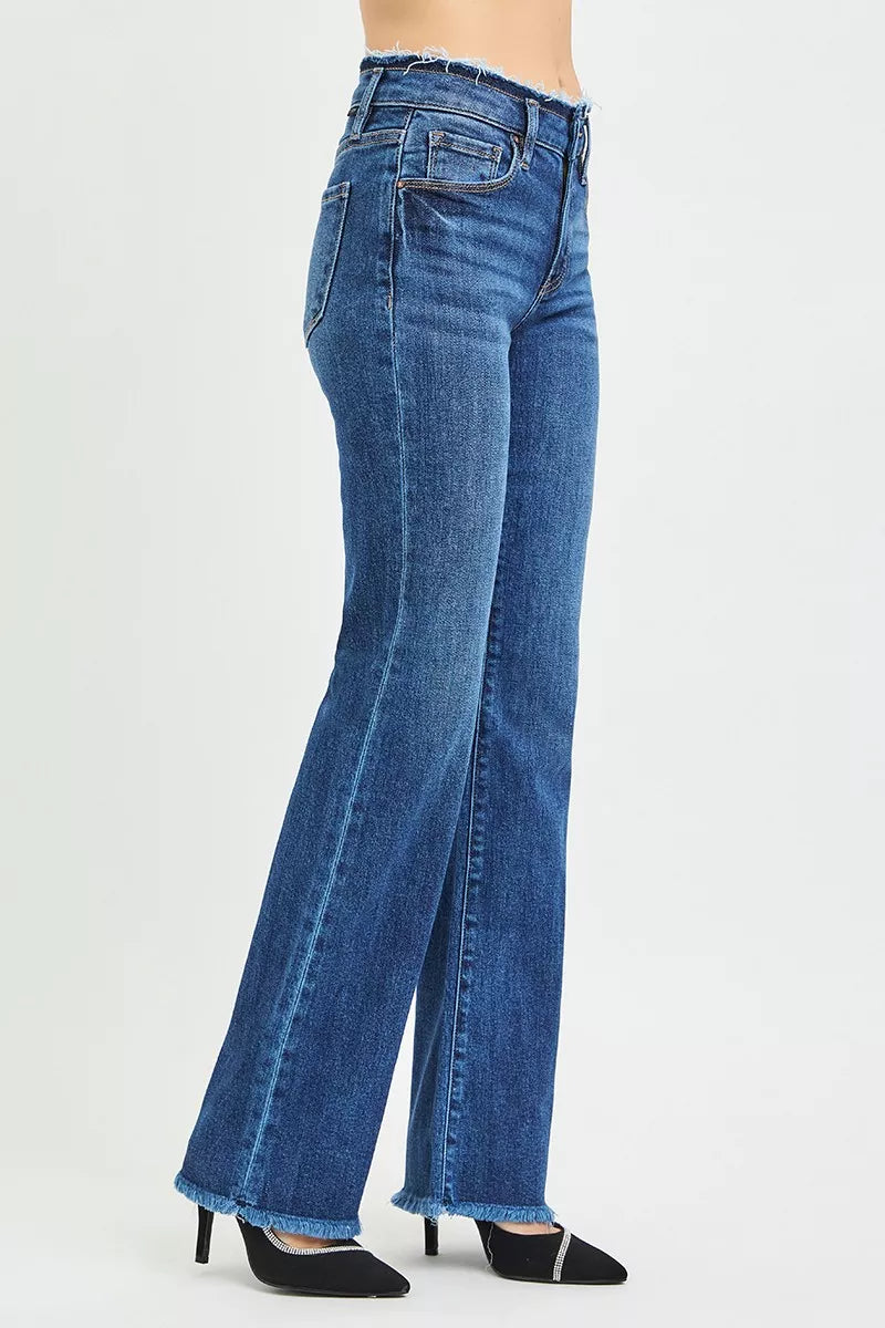 Dark blue mid-rise bootcut jeans with flared leg and frayed hem