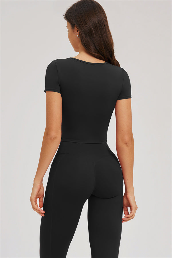 Black T-shirt and leggings set, back view with short sleeves and fitted pants