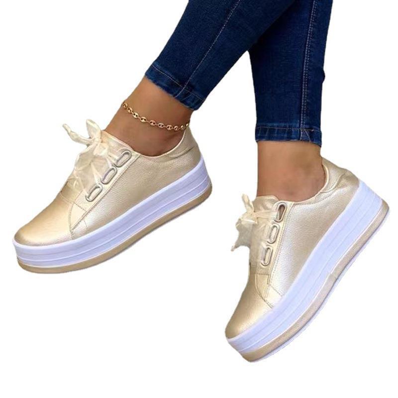 Light gold lace-up platform shoes, round toe, side view with tulle bow, white sole