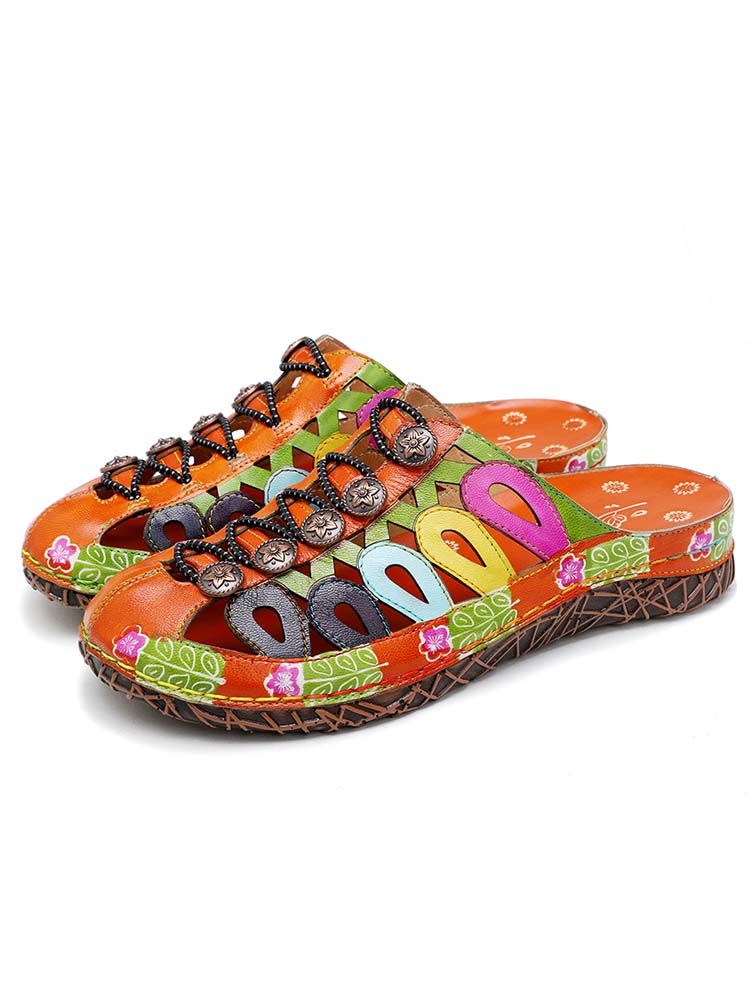 Pair of colorful handmade mule sandals with multicolor geometric panels and lace straps
