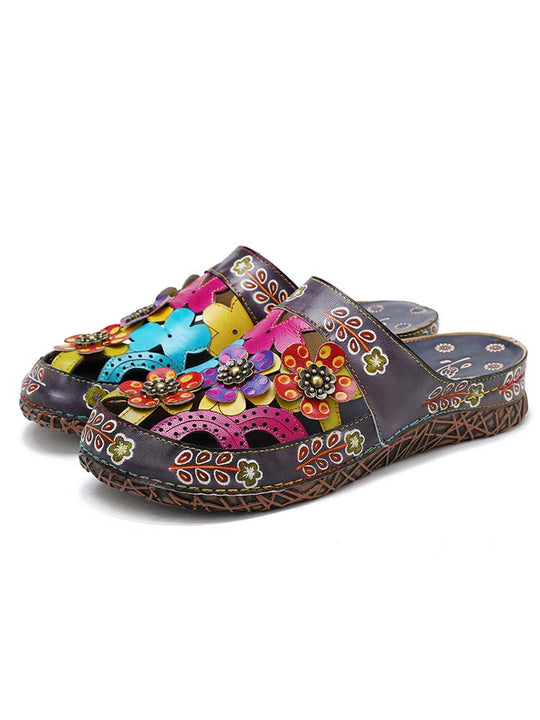Pair of floral handmade slides with multicolor flower decorations on dark upper