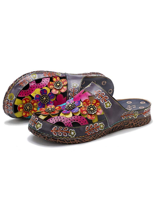 Floral slide slippers showing side panel with colorful flower appliqués and beaded motifs