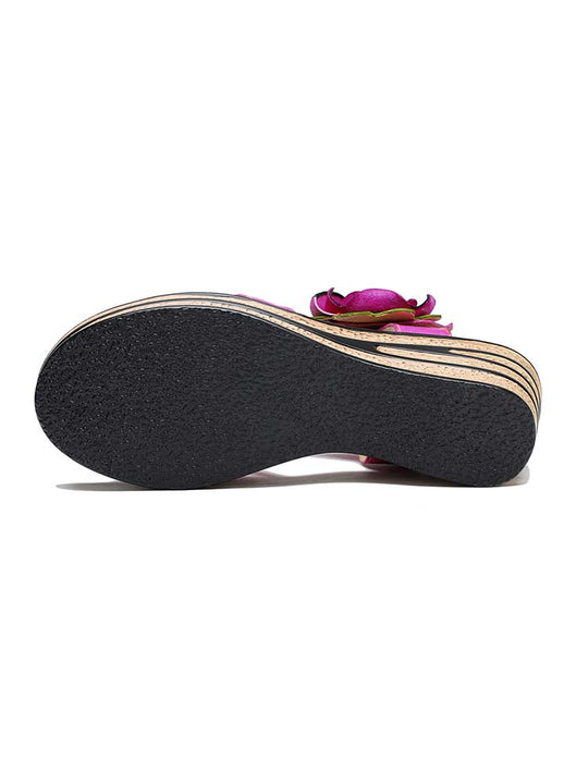 Rose wedge sandals outsole view with textured black tread and stacked wedge base