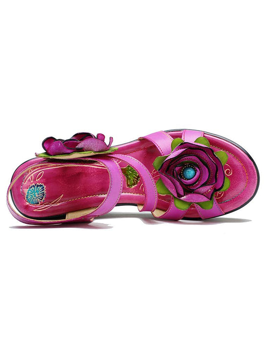 Rose wedge sandals, side view: pink upper with flower and patterned insole