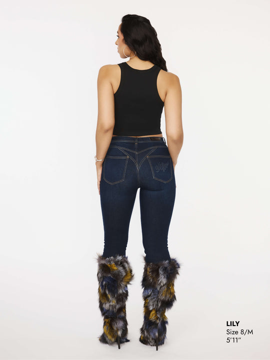 Dark blue skinny jeans back view with logo patch on the yoke
