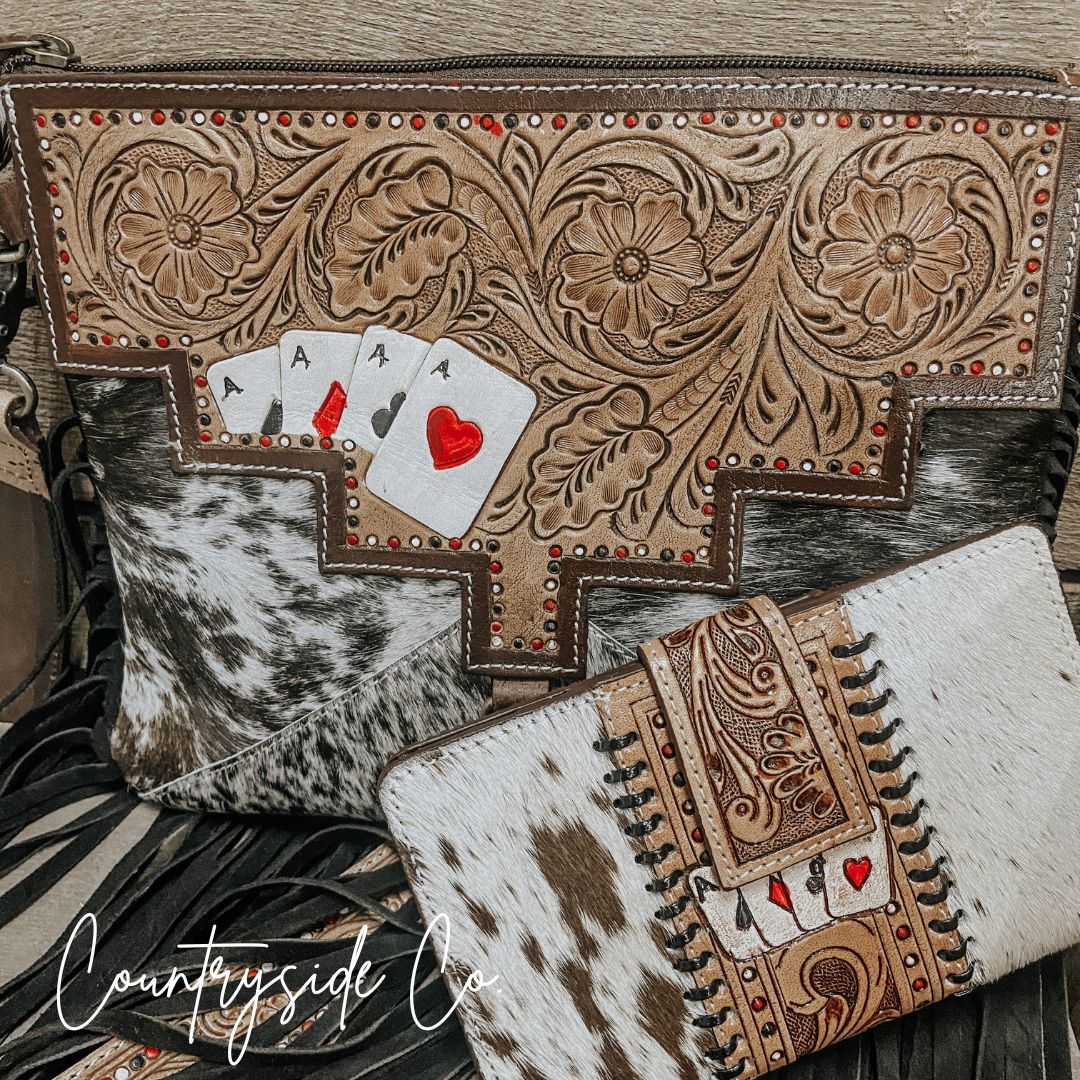 Embossed tan floral panels with playing-card A and heart, plus cowhide fringe