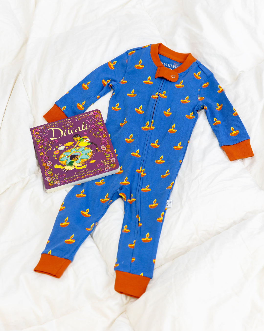 Blue baby sleeper with yellow diya pattern and orange trim, long sleeves; Diwali card shown