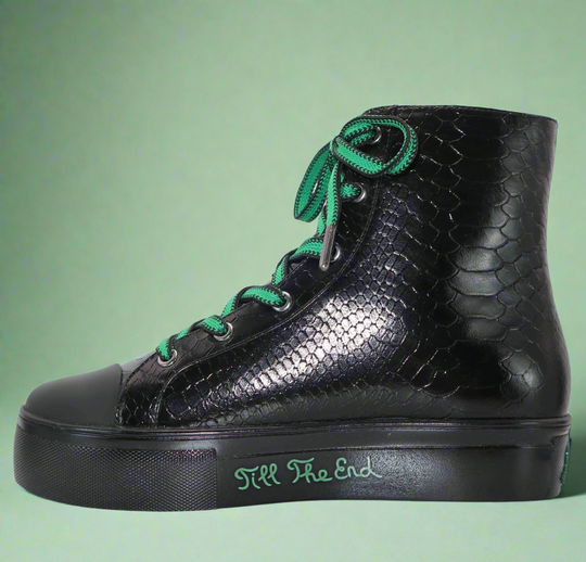 Black high-top sneaker with embossed crocodile pattern, green laces and side zipper