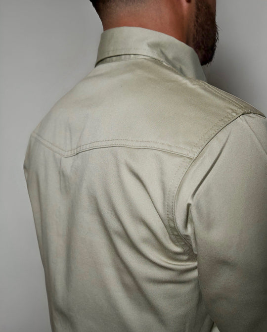 Khaki FR Western shirt back view with yoke seam and smooth shoulder